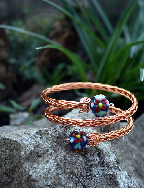 Copper wire armcuff with glass beads, An intricately handwo…