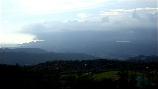 WACTHING FROM  MT. TANO as a STORM ROLLS OVER TWO DISTANT MOUNTAIN RANGES