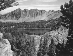 Scenic picture of lake with mountains in background. KD Swan. 1938. Gallatin National Forest.