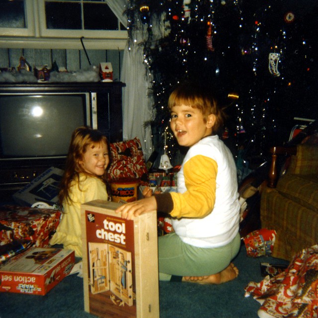 Michael and Leslie Checking Out Gifts Under the Christmas Tree - Old Scan