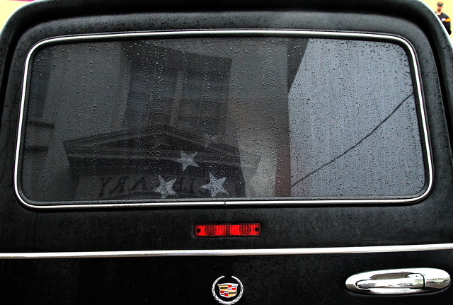 Ralph's casket in the hearse, City Hall in the reflection.