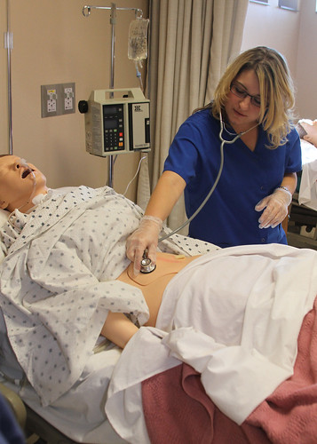Nursing Student Working on Patient Simulator