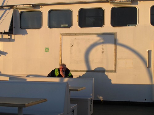 The captain by hannanik, Stefan, a pilot boat captain, smokes on the deck of M/S Eivor en route from <a href="http://www.uto.