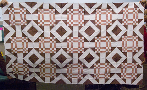 I still need to do a sunlit photo; it's prettier in sunlight, but it's raining and dreary today, so crappy fluorescent-lit photo it is!

More info on why this quilt exists and has the pattern it does: domesticat.net/quilts/linus