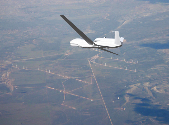 Blender3D model of Global Hawk RQ-4A Global Hawk UAV over a windfarm