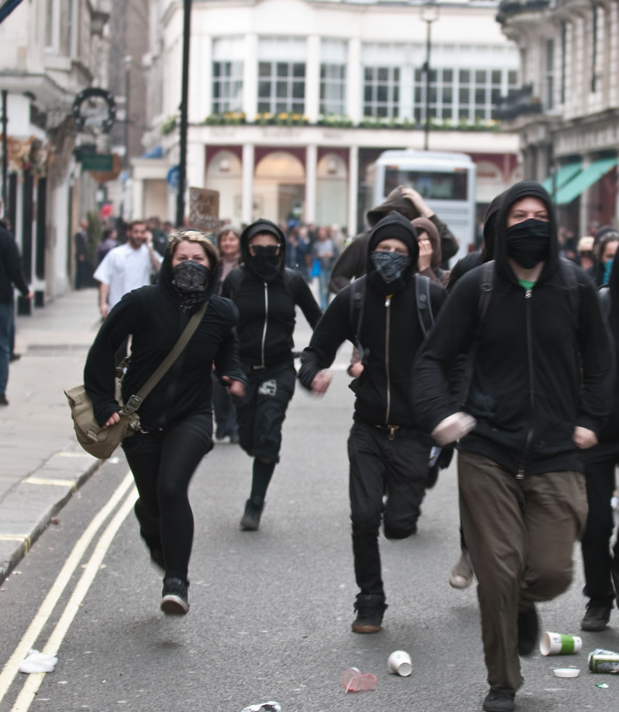 Masked protesters charge at the back of Fortnum and Mason | Flickr