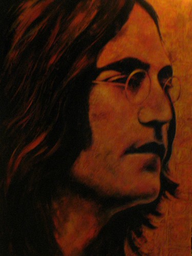 Musician in profile against a warm orange background