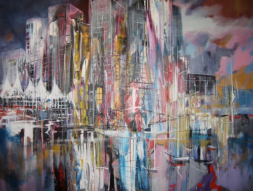 Tall city buildings with pink and blue reflections