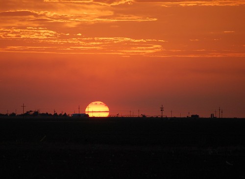 sunset orange clouds texas beltofvenus lubbock pumpjack pivotirrigation