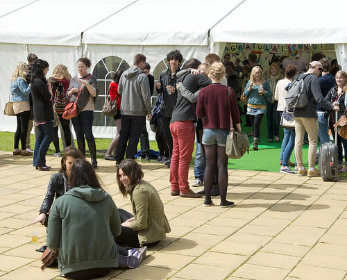 Students sitting outside the law tent
