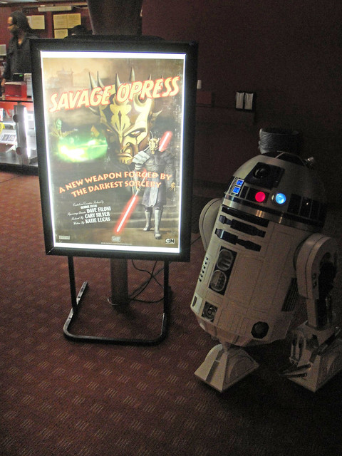 Clone Wars screening - R2-D2 poses with the Clone Wars screening poster