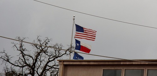 The stong winds pull on these flags. | by TrafficChess