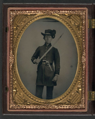 [Unidentified young soldier in Confederate uniform and Hardee hat with holstered revolver and artillery saber] (LOC) | by The Library of Congress