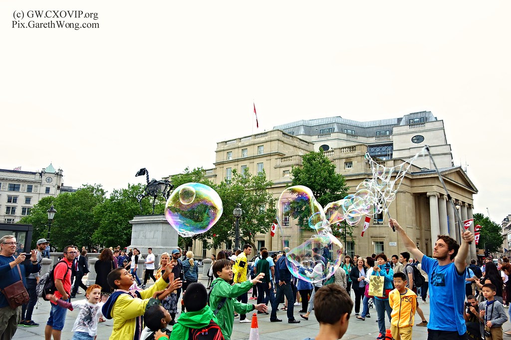 kids enjoying big soap bubbles at Trafalgar square London from RAW _DSC8251 by garethwong