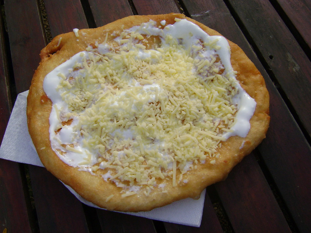 Langosh with sour cream and cheese