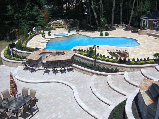 Luxury full pool and patio landscape and design with new addition