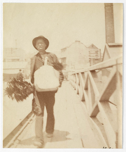A chimney sweep [?] walking across Pyrmont Bridge  Sydney, ca. 1885-1890 / photographed by Arthur K. Syer | by State Library of NSW