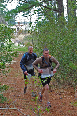  two men running  on trail