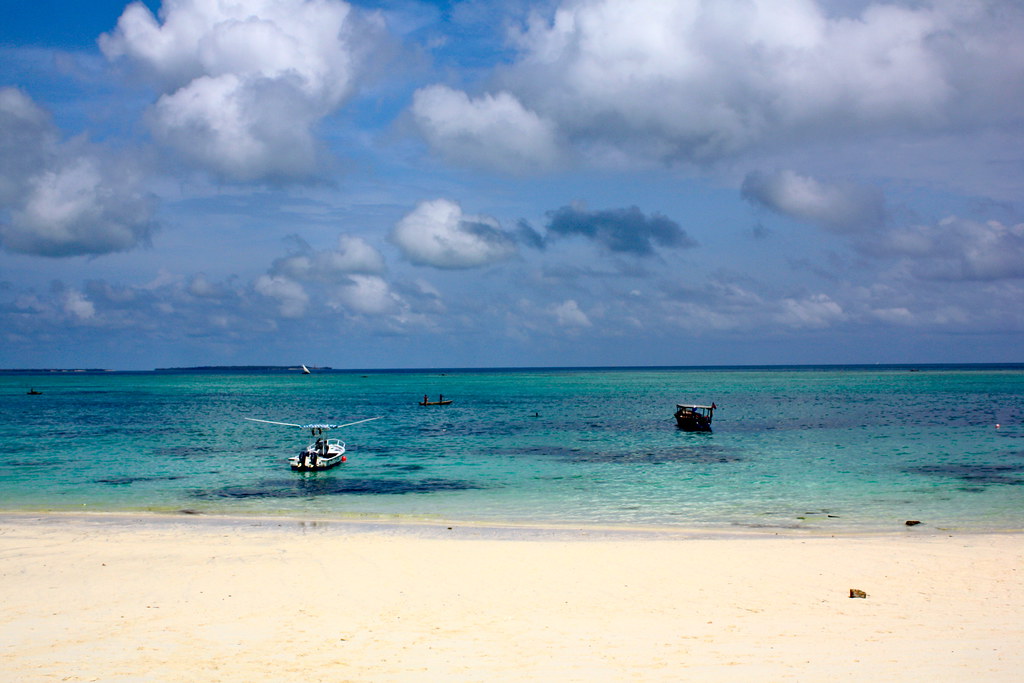 Small boats moored in the turquoise water off Kendwa Beach, Zanzibar