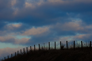sunrise and fence posts