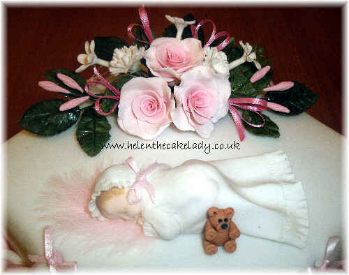 2 tier Christening cake with baby & flower topper