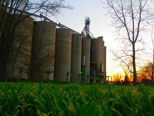 Small Town Fame by Namtrahkym, A beacon of our small Ohio town caught in the sunset from the grounds perspective :)blue light sunse