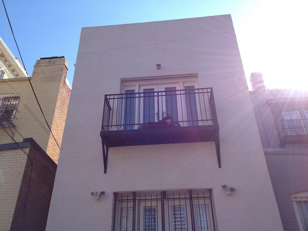 Husky on the balcony in Lanier Heights