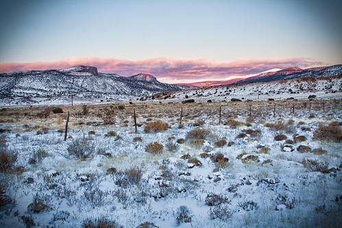 sunset sky snow mountains newmexico field clouds fence landscape glow newyears2011