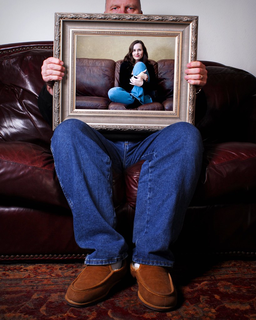 Portrait of a Man with a Portrait of Cynthia K by Studio d'Xavier