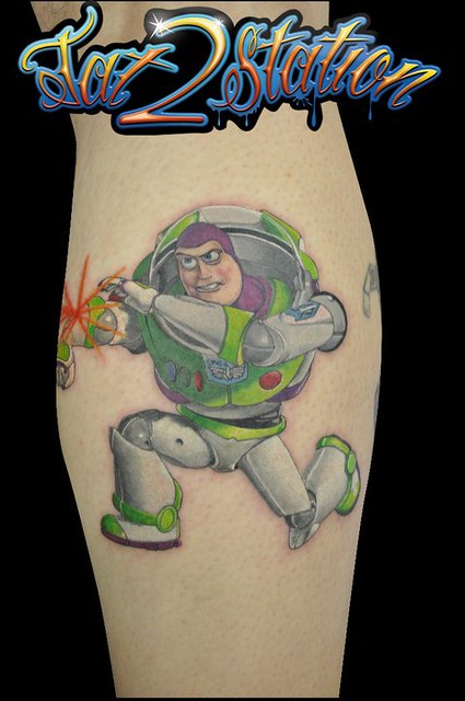 Pop art Buzz Lightyear tattoo on the thigh.