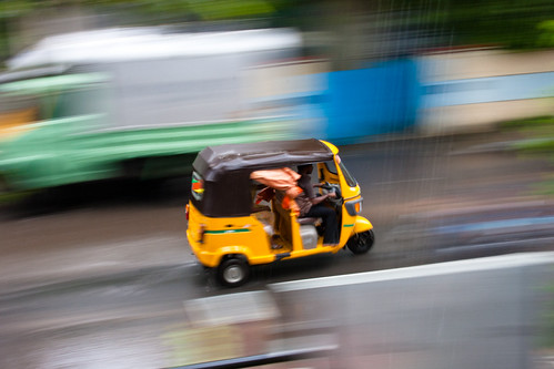 go auto go | Yellow auto flying through the rain | Arun | Flickr