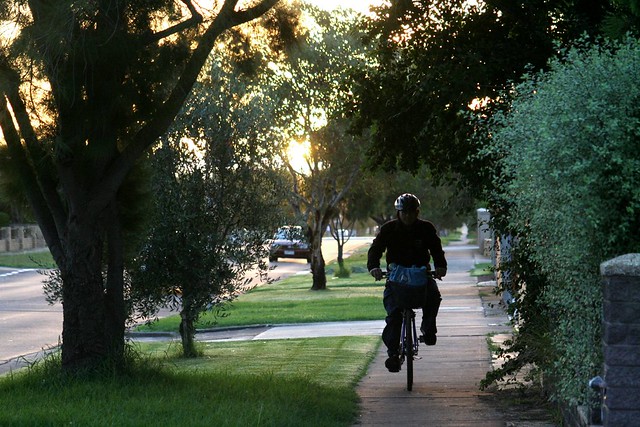 Fawkner cyclist on footpath at sunset