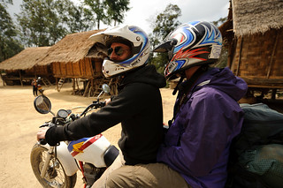 Pete & Natasha on Motorcycle in Lao Village | by goingslowly