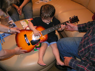 Max strums his new guitar...