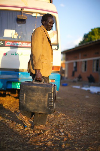 sunset man bus southsudan perspective luggage elderly return older unhcr waystation returnee torit easternequatoriastate