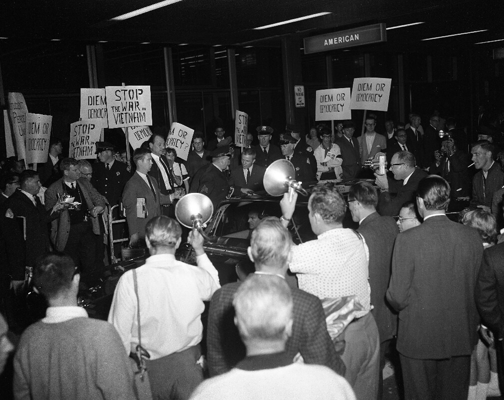 Anti-Diem demonstrators picket at O'Hare Airport when Mme Ngo Dinh Nhu and her daughter arrive at O'Hare Airport and try to leave in a chauferred vehicle. October 1963