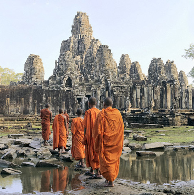 Buddhist monks walking towards Bayon Temple