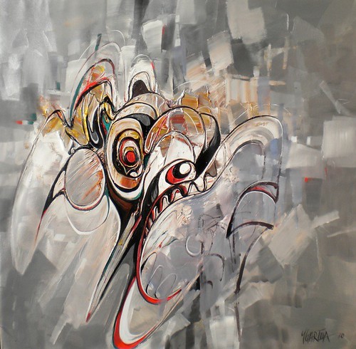 Birdlike mask with a long curved beak on a grey background