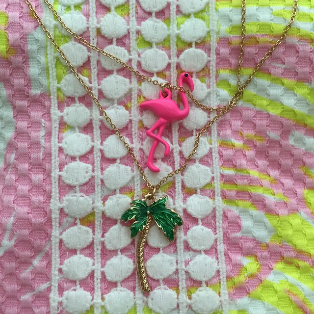 Got these pretty flamingo and palm tree pendants from H&M, which go well with my fan dance Lilly Pulitzer shift pictured here as the background of these lovely necklaces! 🎀💖 #jlsfinds #jlsstyle