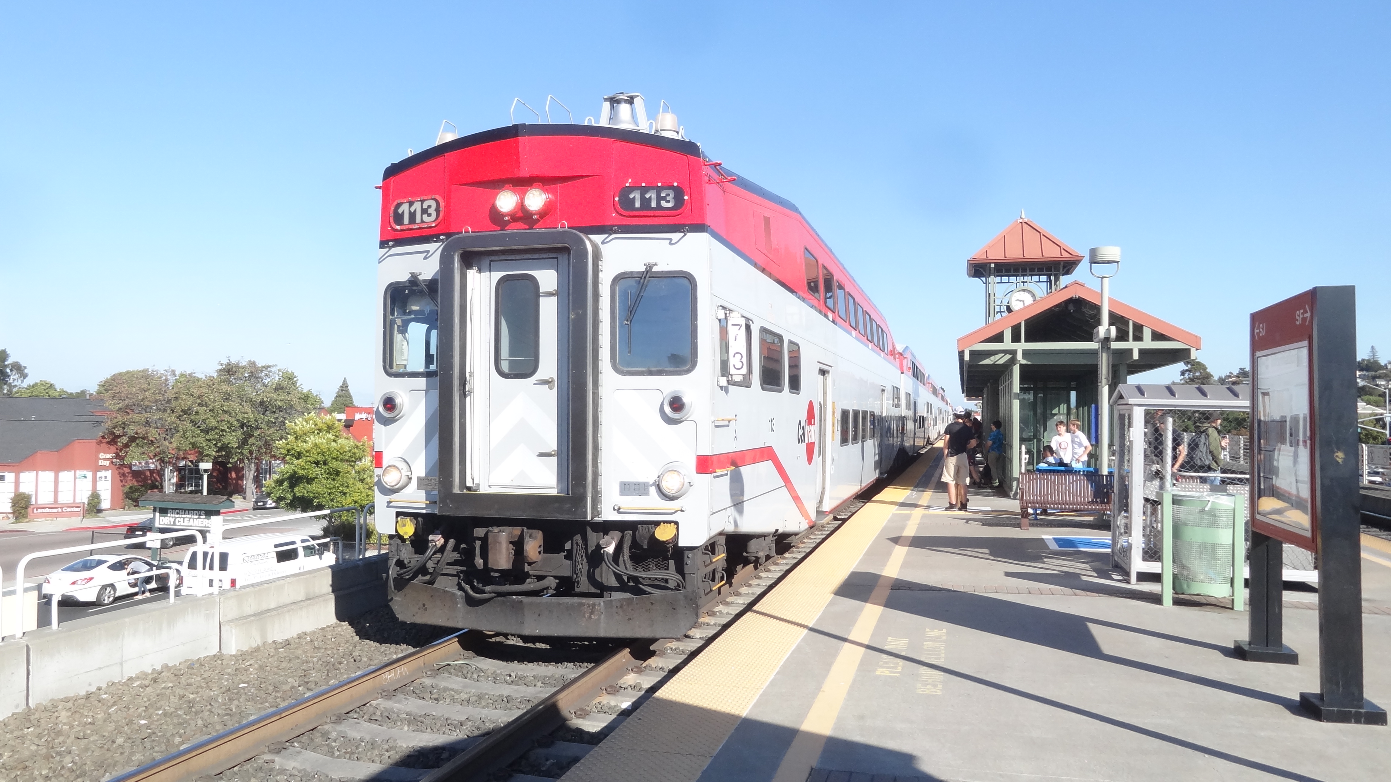 Bombardier Bilevel cab car unit 113 leading a northbound train to San Francisco at Belmont Station