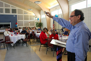 The crowd says "get well soon" to the Honorable Irene Sullivan, who could not attend due to illness, on Jack Levine's telephone during his special guest presentation at Guardian ad Litem Appreciation Day on May 12, 2012 in Tallahassee, Florida. | by flguardian2