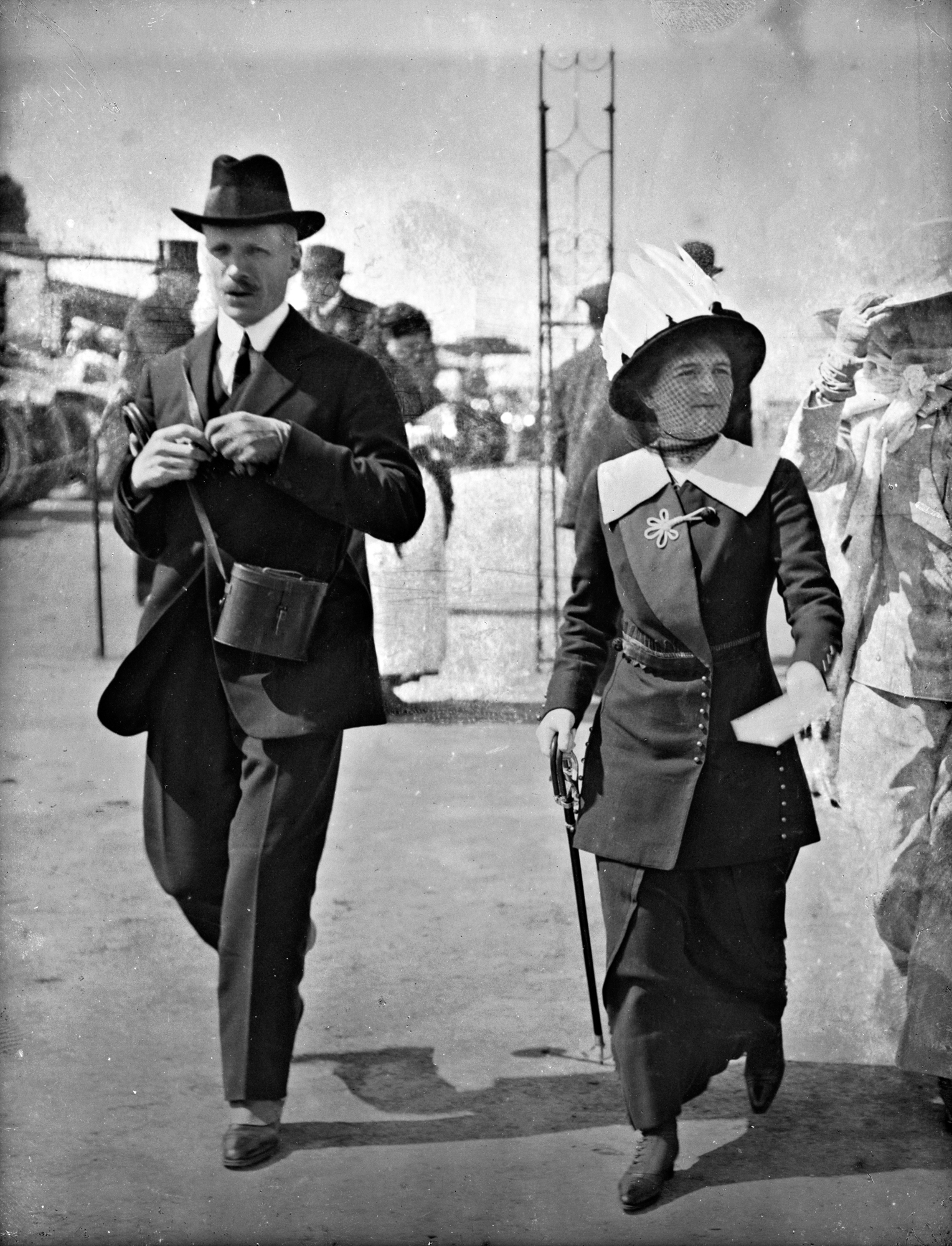 Spit, spot, spats, striding strongly!  Mr. and Mrs. Herbert Goff at the races!