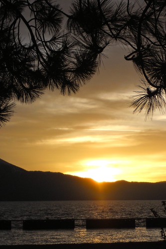 Lake Tahoe Sunset 2: The Sun by kleepet, The sun is going down behind the mountains of Lake Tahoe at the marina at the end of the street by o