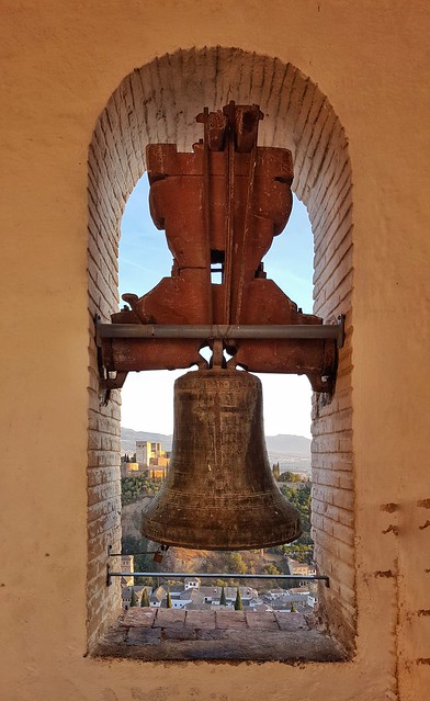 In the bell tower of the Church of Saint Nicolas, Granada, Spain. The Alhambra is in the background.