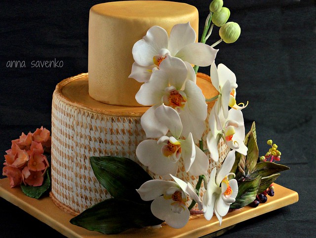 Golden cake with orchids