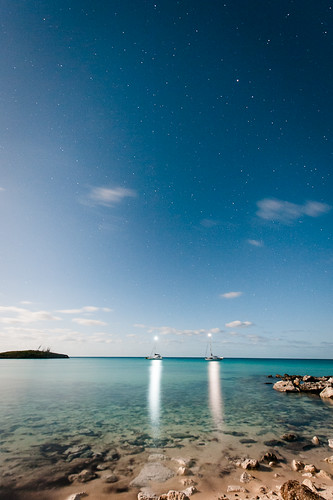 ocean blue sky beach night dark stars boats lights rocks caribbean bahamas eleuthera