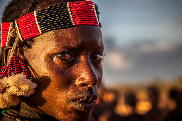 portrait of the Hamer tribe boy with necklaces ethnic, south omo valley, ethiopia