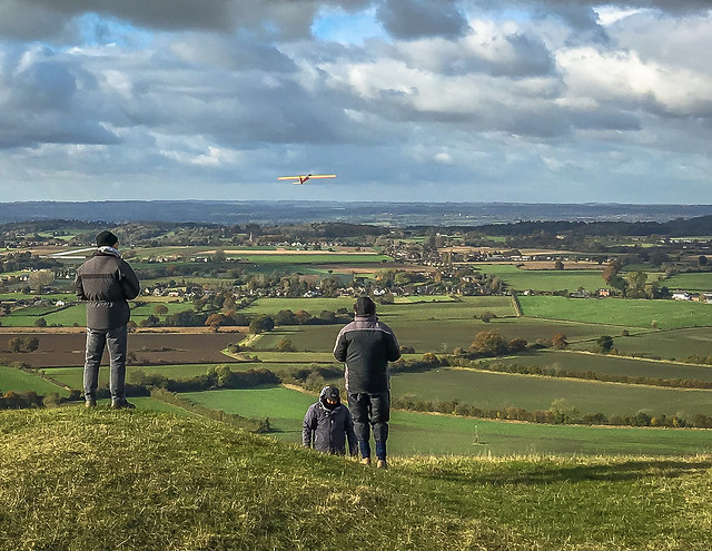 Model plane enthusiasts fly their gliders from Roundway Hill near Devizes in Wiltshire