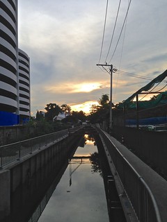Sunset over the Khlong (canal) behind Imperial World shopping center on Lad Phrao in Bangkok, Thailand