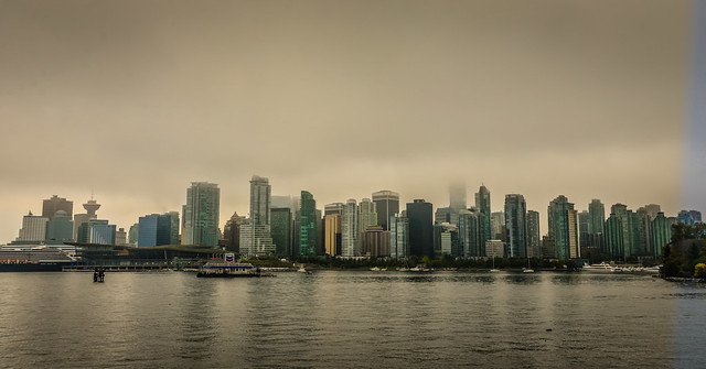 Vancouver Skyline on foggy day viewed from Stanley Park - Vancouver BC Canada